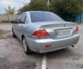 Серый Мицубиси Лансер, объемом двигателя 1.6 л и пробегом 235 тыс. км за 2550 $, фото 2 на Automoto.ua