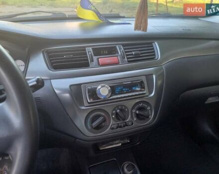 Мицубиси Лансер 2007 в Львове на Automoto.ua Серый Мицубиси Лансер, объемом двигателя 1.6 л и пробегом 224 тыс. км за 3200 $, фото 14 на Automoto.ua