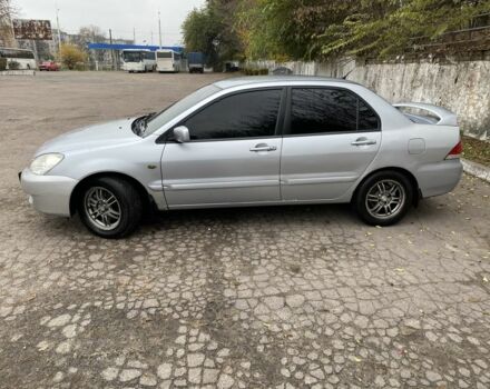 Серый Мицубиси Лансер, объемом двигателя 1.6 л и пробегом 380 тыс. км за 4000 $, фото 1 на Automoto.ua