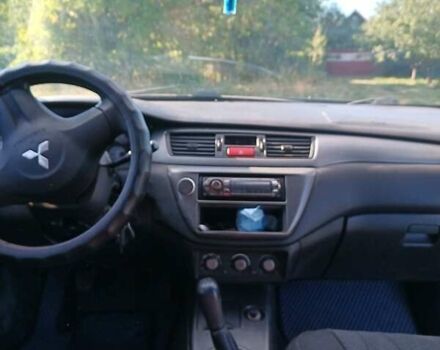 Серый Мицубиси Лансер, объемом двигателя 1.58 л и пробегом 300 тыс. км за 4400 $, фото 6 на Automoto.ua