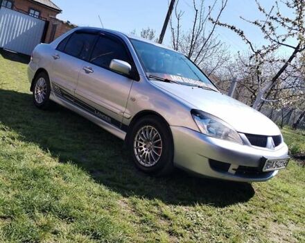Сірий Міцубісі Lancer, об'ємом двигуна 1.6 л та пробігом 290 тис. км за 4600 $, фото 11 на Automoto.ua