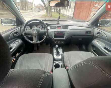 Серый Мицубиси Лансер, объемом двигателя 2 л и пробегом 230 тыс. км за 4000 $, фото 7 на Automoto.ua