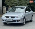 Серый Мицубиси Лансер, объемом двигателя 1.58 л и пробегом 241 тыс. км за 3750 $, фото 4 на Automoto.ua