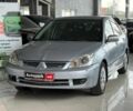 Серый Мицубиси Лансер, объемом двигателя 1.6 л и пробегом 174 тыс. км за 5990 $, фото 1 на Automoto.ua