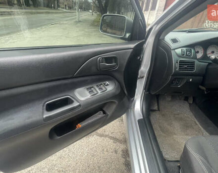 Серый Мицубиси Лансер, объемом двигателя 2 л и пробегом 230 тыс. км за 4000 $, фото 6 на Automoto.ua