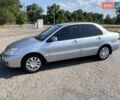 Серый Мицубиси Лансер, объемом двигателя 1.6 л и пробегом 283 тыс. км за 4900 $, фото 1 на Automoto.ua