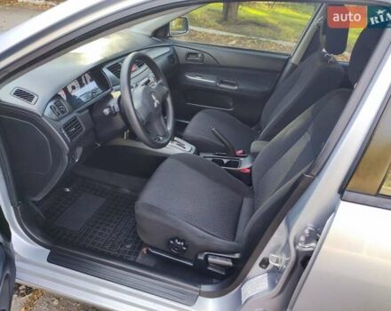 Сірий Міцубісі Lancer, об'ємом двигуна 1.58 л та пробігом 122 тис. км за 6300 $, фото 30 на Automoto.ua