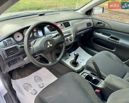 Сірий Міцубісі Lancer, об'ємом двигуна 1.58 л та пробігом 138 тис. км за 4990 $, фото 23 на Automoto.ua