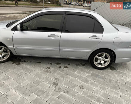 Серый Мицубиси Лансер, объемом двигателя 1.6 л и пробегом 263 тыс. км за 2350 $, фото 11 на Automoto.ua