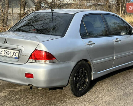 Серый Мицубиси Лансер, объемом двигателя 1.58 л и пробегом 290 тыс. км за 3750 $, фото 3 на Automoto.ua