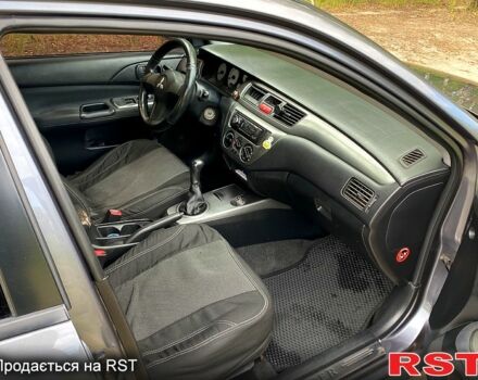 Серый Мицубиси Лансер, объемом двигателя 1.6 л и пробегом 212 тыс. км за 4600 $, фото 7 на Automoto.ua