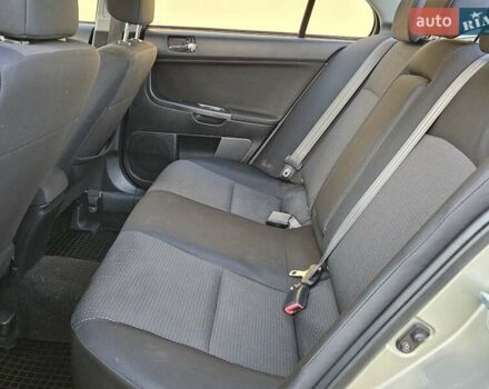 Серый Мицубиси Лансер, объемом двигателя 2 л и пробегом 282 тыс. км за 5450 $, фото 72 на Automoto.ua