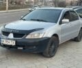 Сірий Міцубісі Lancer, об'ємом двигуна 1.6 л та пробігом 300 тис. км за 3550 $, фото 1 на Automoto.ua