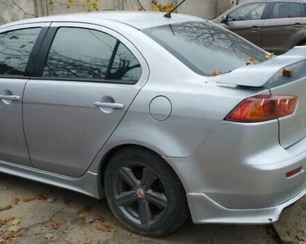 Серый Мицубиси Лансер, объемом двигателя 2 л и пробегом 305 тыс. км за 6300 $, фото 3 на Automoto.ua