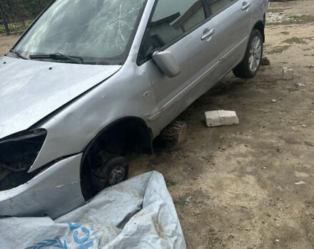Сірий Міцубісі Lancer, об'ємом двигуна 1.58 л та пробігом 210 тис. км за 1300 $, фото 4 на Automoto.ua