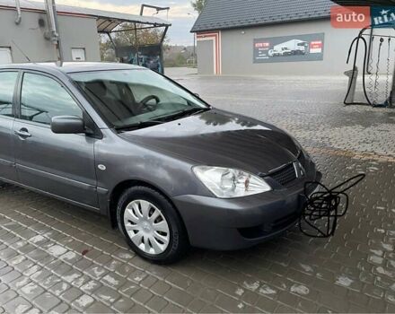 Сірий Міцубісі Lancer, об'ємом двигуна 1.6 л та пробігом 330 тис. км за 3500 $, фото 17 на Automoto.ua