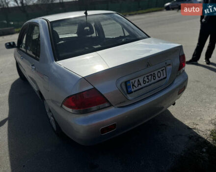 Серый Мицубиси Лансер, объемом двигателя 1.58 л и пробегом 261 тыс. км за 4500 $, фото 11 на Automoto.ua