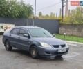 Серый Мицубиси Лансер, объемом двигателя 1.58 л и пробегом 300 тыс. км за 3999 $, фото 1 на Automoto.ua