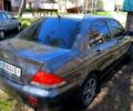 Сірий Міцубісі Lancer, об'ємом двигуна 1.6 л та пробігом 270 тис. км за 4500 $, фото 1 на Automoto.ua