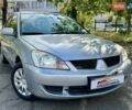Сірий Міцубісі Lancer, об'ємом двигуна 1.58 л та пробігом 138 тис. км за 4990 $, фото 2 на Automoto.ua