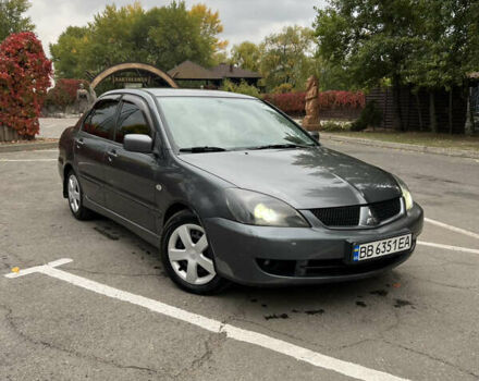 Сірий Міцубісі Lancer, об'ємом двигуна 1.58 л та пробігом 176 тис. км за 4700 $, фото 5 на Automoto.ua