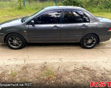 Серый Мицубиси Лансер, объемом двигателя 1.6 л и пробегом 212 тыс. км за 4600 $, фото 1 на Automoto.ua