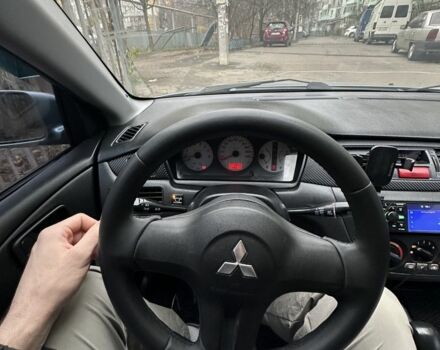 Серый Мицубиси Лансер, объемом двигателя 1.6 л и пробегом 238 тыс. км за 4300 $, фото 1 на Automoto.ua