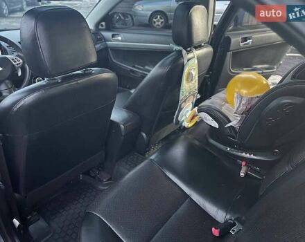 Серый Мицубиси Лансер, объемом двигателя 2 л и пробегом 170 тыс. км за 6999 $, фото 9 на Automoto.ua