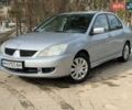 Сірий Міцубісі Lancer, об'ємом двигуна 1.58 л та пробігом 183 тис. км за 4200 $, фото 1 на Automoto.ua