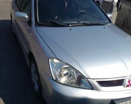 Серый Мицубиси Лансер, объемом двигателя 1.6 л и пробегом 210 тыс. км за 3500 $, фото 1 на Automoto.ua