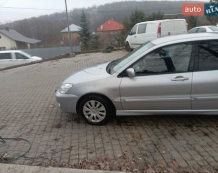 Серый Мицубиси Лансер, объемом двигателя 1.6 л и пробегом 175 тыс. км за 4200 $, фото 12 на Automoto.ua