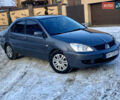 Сірий Міцубісі Lancer, об'ємом двигуна 1.6 л та пробігом 239 тис. км за 4500 $, фото 1 на Automoto.ua