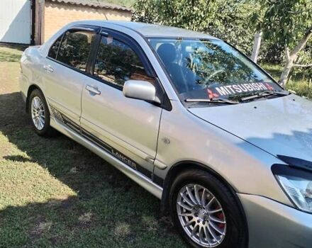 Сірий Міцубісі Lancer, об'ємом двигуна 1.6 л та пробігом 290 тис. км за 4600 $, фото 12 на Automoto.ua