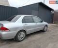 Серый Мицубиси Лансер, объемом двигателя 1.6 л и пробегом 235 тыс. км за 4500 $, фото 1 на Automoto.ua