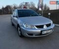 Серый Мицубиси Лансер, объемом двигателя 1.58 л и пробегом 217 тыс. км за 3300 $, фото 1 на Automoto.ua