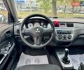 Сірий Міцубісі Lancer, об'ємом двигуна 1.58 л та пробігом 138 тис. км за 4990 $, фото 21 на Automoto.ua