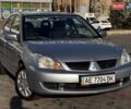 Сірий Міцубісі Lancer, об'ємом двигуна 1.6 л та пробігом 237 тис. км за 4950 $, фото 1 на Automoto.ua