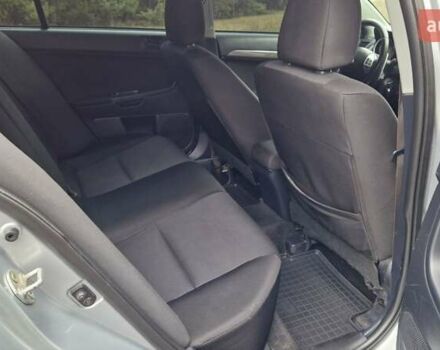 Серый Мицубиси Лансер, объемом двигателя 2 л и пробегом 213 тыс. км за 6550 $, фото 20 на Automoto.ua