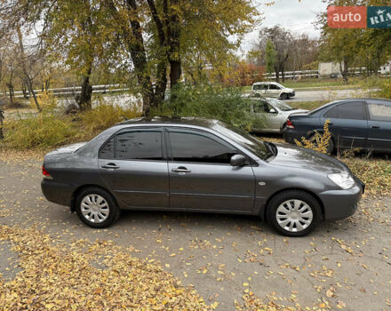 Сірий Міцубісі Lancer, об'ємом двигуна 1.58 л та пробігом 247 тис. км за 4900 $, фото 4 на Automoto.ua
