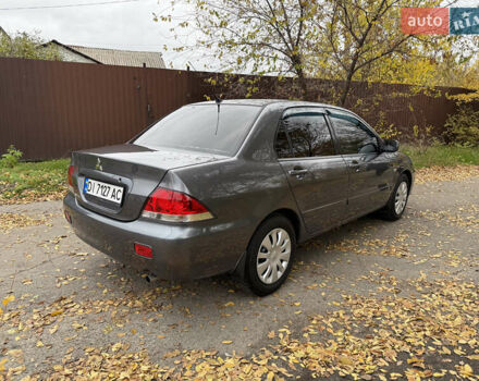 Сірий Міцубісі Lancer, об'ємом двигуна 1.58 л та пробігом 247 тис. км за 4900 $, фото 10 на Automoto.ua