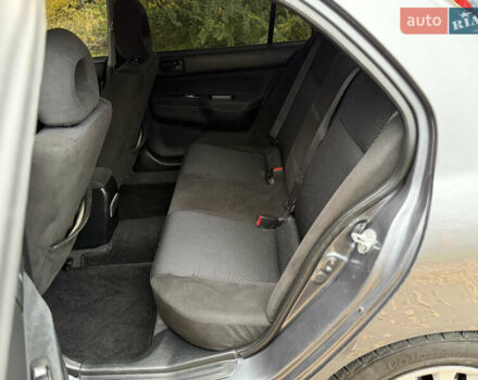 Сірий Міцубісі Lancer, об'ємом двигуна 1.58 л та пробігом 247 тис. км за 4900 $, фото 18 на Automoto.ua