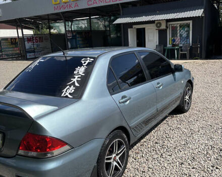 Сірий Міцубісі Lancer, об'ємом двигуна 1.58 л та пробігом 180 тис. км за 4400 $, фото 1 на Automoto.ua
