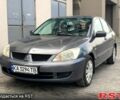 Сірий Міцубісі Lancer, об'ємом двигуна 1.6 л та пробігом 225 тис. км за 4200 $, фото 1 на Automoto.ua