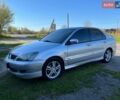 Сірий Міцубісі Lancer, об'ємом двигуна 2 л та пробігом 224 тис. км за 4750 $, фото 1 на Automoto.ua