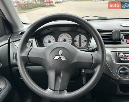 Серый Мицубиси Лансер, объемом двигателя 1.6 л и пробегом 116 тыс. км за 5050 $, фото 24 на Automoto.ua