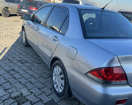 Серый Мицубиси Лансер, объемом двигателя 1.58 л и пробегом 178 тыс. км за 3300 $, фото 13 на Automoto.ua