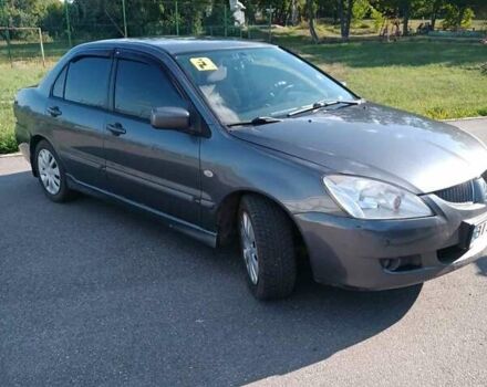 Серый Мицубиси Лансер, объемом двигателя 1.58 л и пробегом 300 тыс. км за 4400 $, фото 1 на Automoto.ua