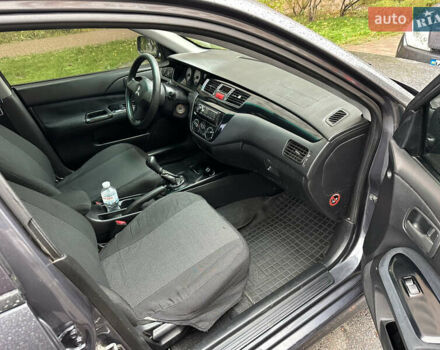 Серый Мицубиси Лансер, объемом двигателя 1.6 л и пробегом 115 тыс. км за 2800 $, фото 8 на Automoto.ua