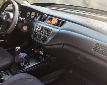 Сірий Міцубісі Lancer, об'ємом двигуна 1.6 л та пробігом 290 тис. км за 4600 $, фото 14 на Automoto.ua