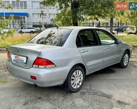 Сірий Міцубісі Lancer, об'ємом двигуна 1.58 л та пробігом 138 тис. км за 4990 $, фото 11 на Automoto.ua